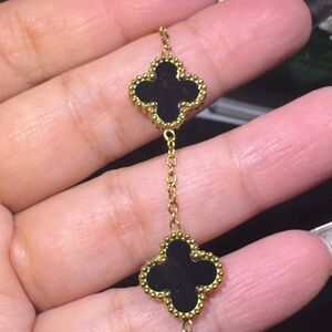Elegant Gold and Black Clover Bracelet